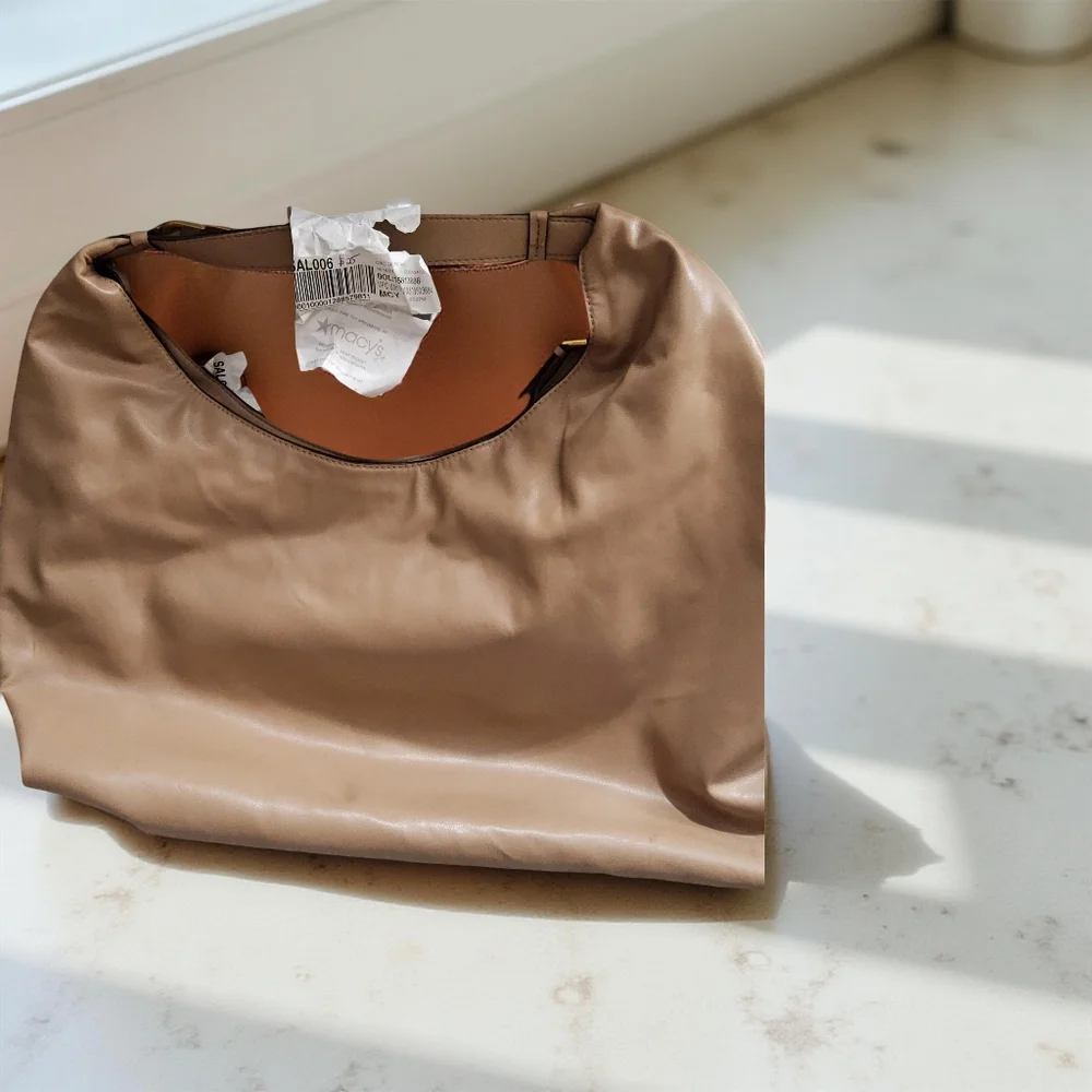 Customer Return Donna Karan Tan Hobo Bag with flaws will take offers